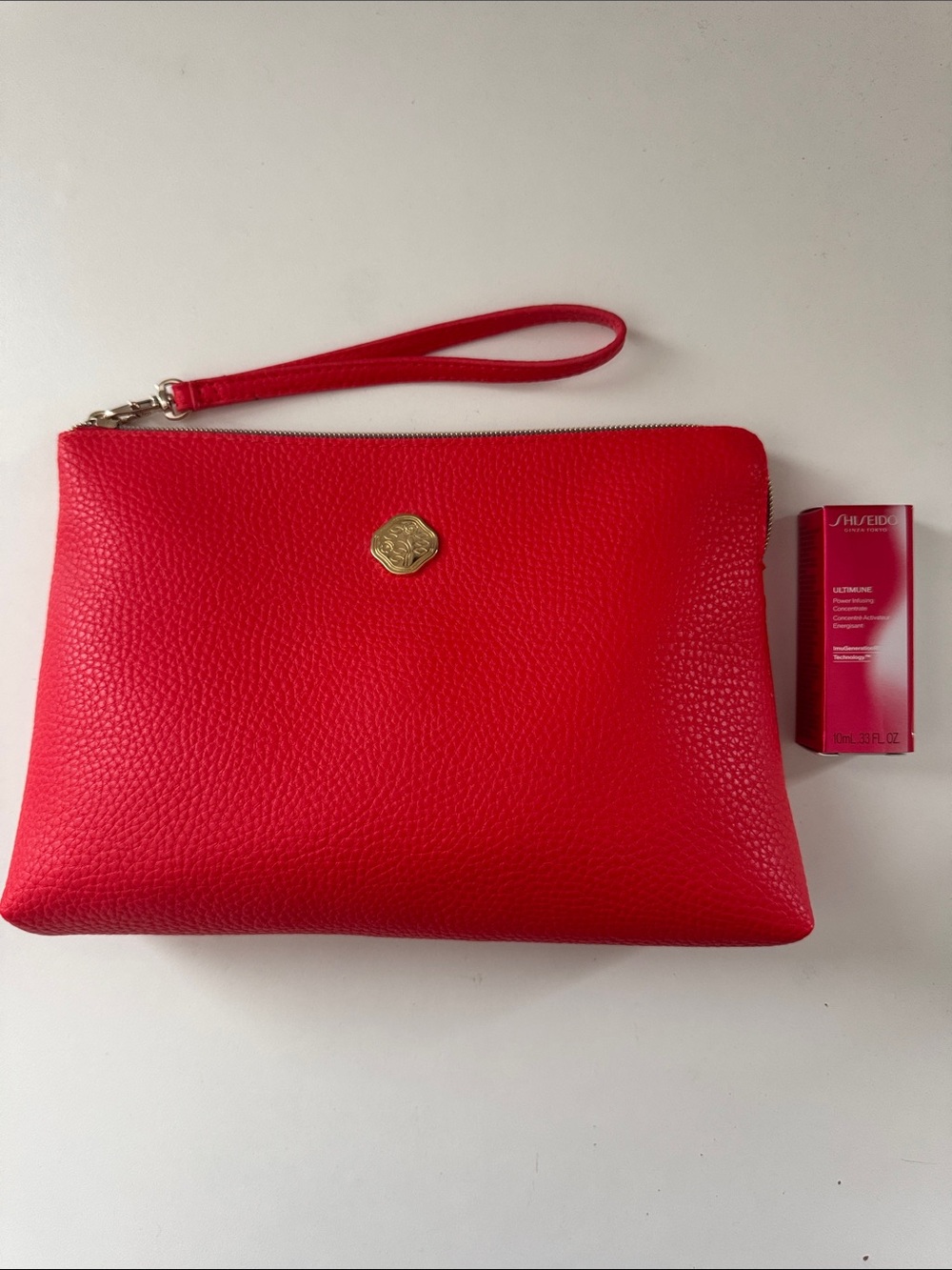 Shiseido Ultimune and Red Pebbled Wristlet Cosmetic Pouch with Gold Emble